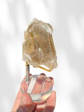 Load image into Gallery viewer, Golden Rutilated Quartz Cluster on stand 03
